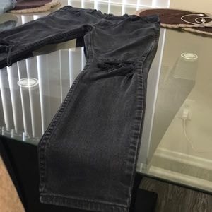 Distressed black faded jeans